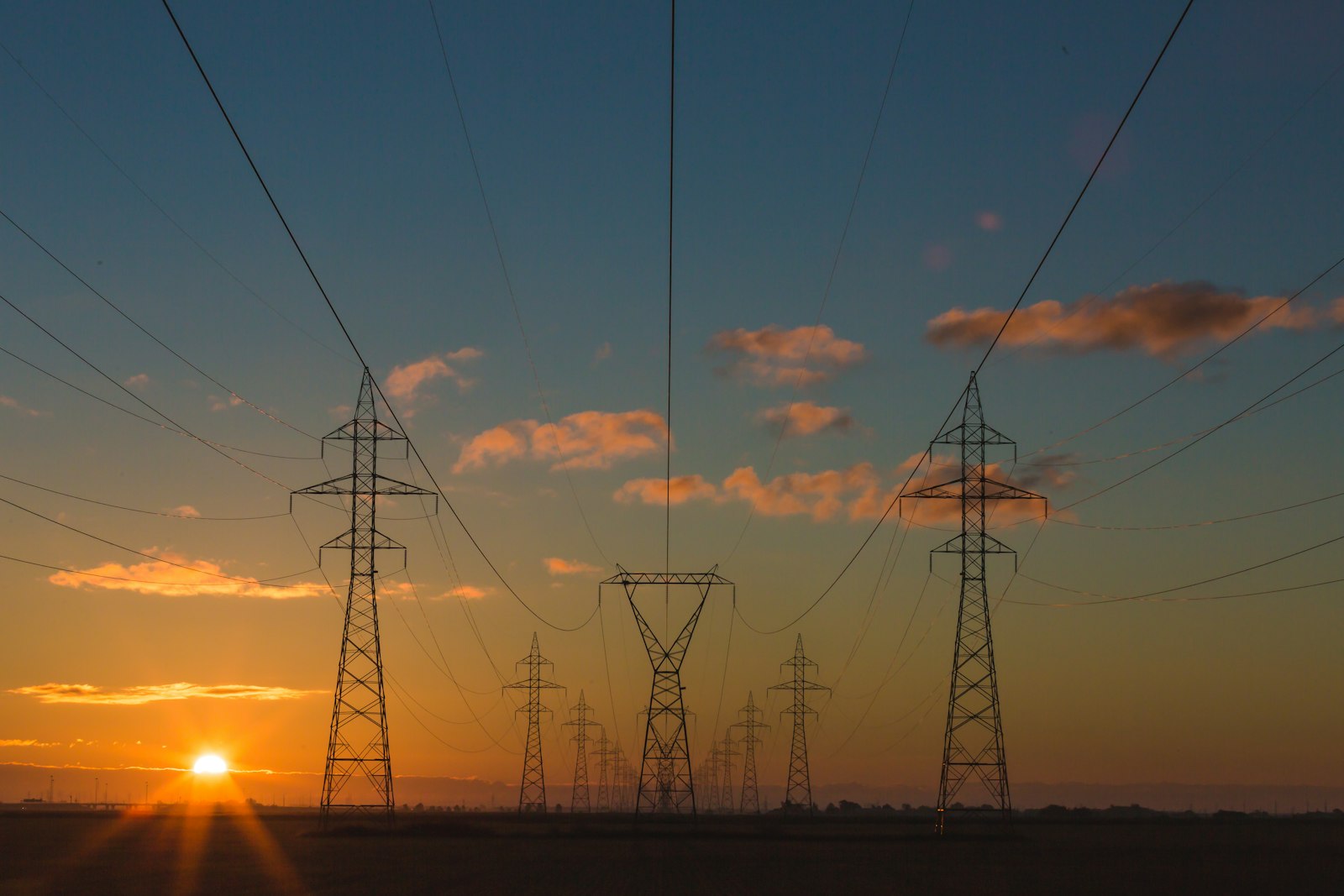 Solar installation at sunset representing renewable energy assets